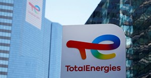 A logo of TotalEnergies is seen at an electric vehicle fuelling station in the La Defense business district in Courbevoie near Paris, France. Source: Reuters/Sarah Meyssonnier.