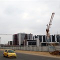 A car drives past a construction site of the Central Business District (CBD) in the capital Gaborone. Source: Reuters/Siphiwe Sibeko