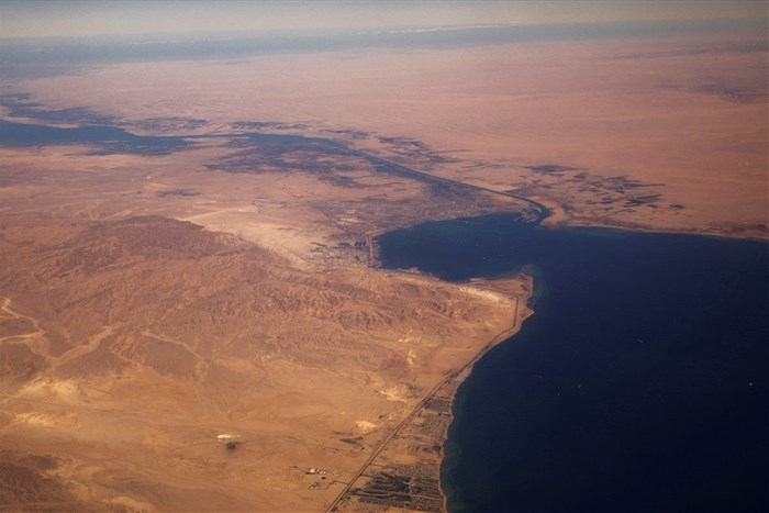 FILE PHOTO: The Suez Canal connecting the Mediterranean Sea to the Red Sea is pictured from the window of a commercial plane flying over Egypt, December 18, 2019. REUTERS/Lucas Jackson/File Photo