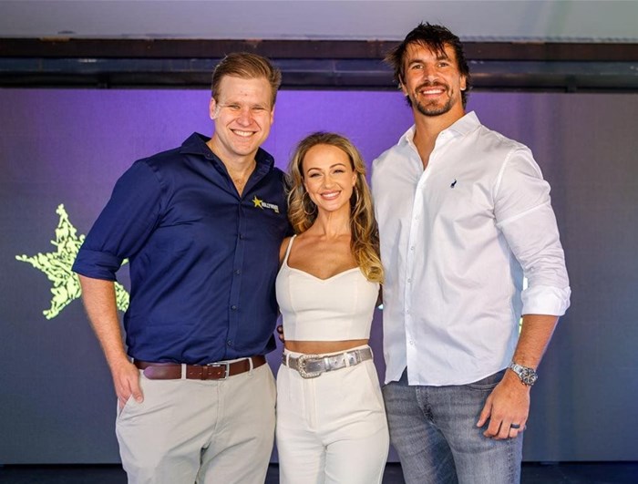 L to R: Devin Heffer, Hollywoodbets brand and communications manager with Anlia and Eben Etzebeth. Image supplied