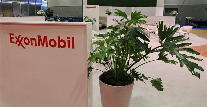 Plants are displayed at the booth of American multinational oil and gas corporation ExxonMobil during the LNG 2023 energy trade show in Vancouver. Source: Reuters/Chris Helgren