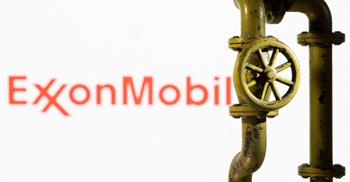 A 3D printed natural gas pipeline is placed in front of displayed ExxonMobil logo. Source: Reuters/Dado Ruvic