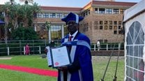Refugee and former car guard graduates with a PhD