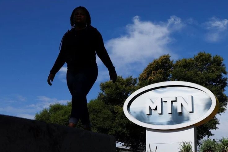 File photo: A person walks past an MTN logo outside the company's headquarters in Johannesburg, South Africa, on 17 November 2023. Reuters/Siphiwe Sibeko/File photo