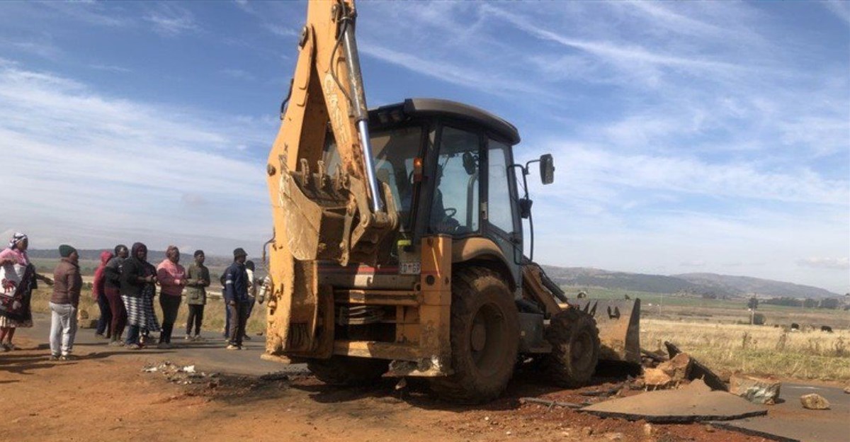Katlehong residents use digger to tear up main road during protest