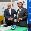 Zululand Energy Terminal director, Oliver Naidu (left) and Eskom group executive for strategic delivery, Alfred Seema, seal the deal with a handshake. Image supplied.