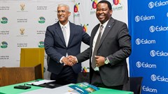 Zululand Energy Terminal director, Oliver Naidu (left) and Eskom group executive for strategic delivery, Alfred Seema, seal the deal with a handshake. Image supplied.