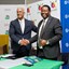 Zululand Energy Terminal director, Oliver Naidu (left) and Eskom group executive for strategic delivery, Alfred Seema, seal the deal with a handshake. Image supplied.