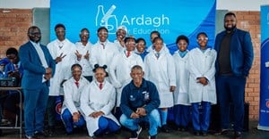 Supplied image: Talifhani Khubana (CFO, Protec), Munei Tshiovhe (GM Business Development, Protec) and Daniel Phukubje (Protec) with students at the official opening of the Science Resource Centre.
