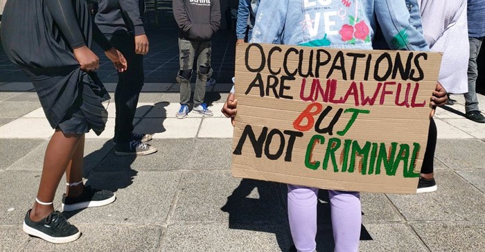 Housing activists protesting at the Cape Town Civic Centre in 2021. Archive photo: Liezl Human/GroundUp
