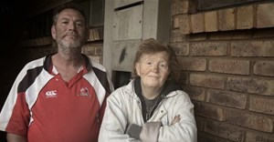 Source: GroundUp/Kimberly Mutandiro. Johan Swanepoel and his partner, Wilma De Villiers, outside their home at Sondela Village.