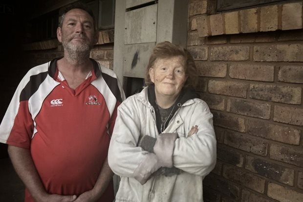 Source: GroundUp/Kimberly Mutandiro. Johan Swanepoel and his partner, Wilma De Villiers, outside their home at Sondela Village.