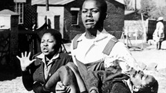 Mbuyisa Makhubu carries Hector Pieterson after Pieterson was shot and killed at the Soweto Uprising. Antoinette Sithol, Pieterson's sister, runs beside them. Image credit: , via Wikimedia Commons