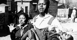 Mbuyisa Makhubu carries Hector Pieterson after Pieterson was shot and killed at the Soweto Uprising. Antoinette Sithol, Pieterson's sister, runs beside them. Image credit: , via Wikimedia Commons