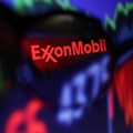 Exxon Mobil logo and stock graph are seen through a magnifier displayed in this illustration taken September 4, 2022. Image credit: Reuters/Dado Ruvic/Illustration