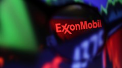 Exxon Mobil logo and stock graph are seen through a magnifier displayed in this illustration taken September 4, 2022. Image credit: Reuters/Dado Ruvic/Illustration