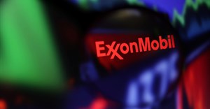 Exxon Mobil logo and stock graph are seen through a magnifier displayed in this illustration taken September 4, 2022. Image credit: Reuters/Dado Ruvic/Illustration