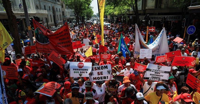 The Congress of South African Trade Unions (Cosatu) and affiliates walk through the street of Cape Town as they embark on a nationwide strike to mark World Day of Decent Work, in Cape Town, South Africa, 7 October 2024. Reuters/Esa Alexander/File Photo