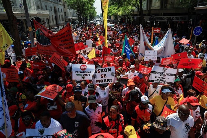 The Congress of South African Trade Unions (Cosatu) and affiliates walk through the street of Cape Town as they embark on a nationwide strike to mark World Day of Decent Work, in Cape Town, South Africa, 7 October 2024. Reuters/Esa Alexander/File Photo
