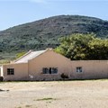 Source: Supplied. A photograph of the outbuildings and farmhouse comprising the Mouton House in McGregor, taken in 2018 before it was completely stripped by vandals.