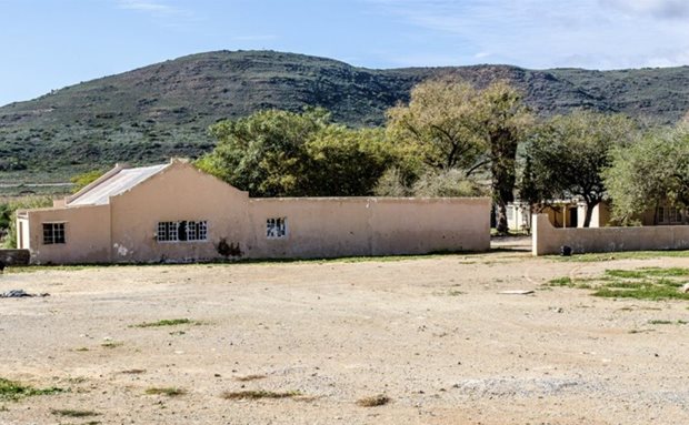 Source: Supplied. A photograph of the outbuildings and farmhouse comprising the Mouton House in McGregor, taken in 2018 before it was completely stripped by vandals.