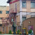 A member of Uganda People's Defence Forces stands at the headquarters of Nation Media Group - Uganda, (NMG-U), a building that houses Daily Monitor, KFM and Dembe FM radios, as government closes the media house, in Kampala, Uganda, June 28, 2026. Source: REUTERS/Stringer
