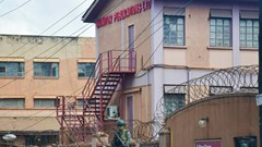 A member of Uganda People's Defence Forces stands at the headquarters of Nation Media Group - Uganda, (NMG-U), a building that houses Daily Monitor, KFM and Dembe FM radios, as government closes the media house, in Kampala, Uganda, June 28, 2026. Source: REUTERS/Stringer