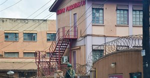 A member of Uganda People's Defence Forces stands at the headquarters of Nation Media Group - Uganda, (NMG-U), a building that houses Daily Monitor, KFM and Dembe FM radios, as government closes the media house, in Kampala, Uganda, June 28, 2026. Source: REUTERS/Stringer