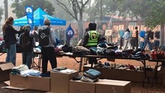 Volunteers unpacking & sorting clothing at The Haven Night Shelter (Image supplied)