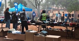 Volunteers unpacking & sorting clothing at The Haven Night Shelter (Image supplied)