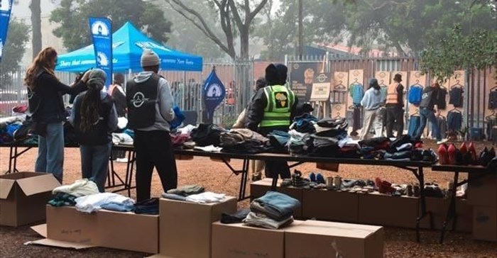 Volunteers unpacking & sorting clothing at The Haven Night Shelter (Image supplied)