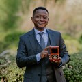 Professor Mike Sathekge – head of the Department of Nuclear Medicine at UP and Steve Biko Academic Hospital, and president and CEO of NuMeRI – with his Harry Oppenheimer Fellowship Award at the announcement ceremony at the Brenthurst Library. Image supplied.