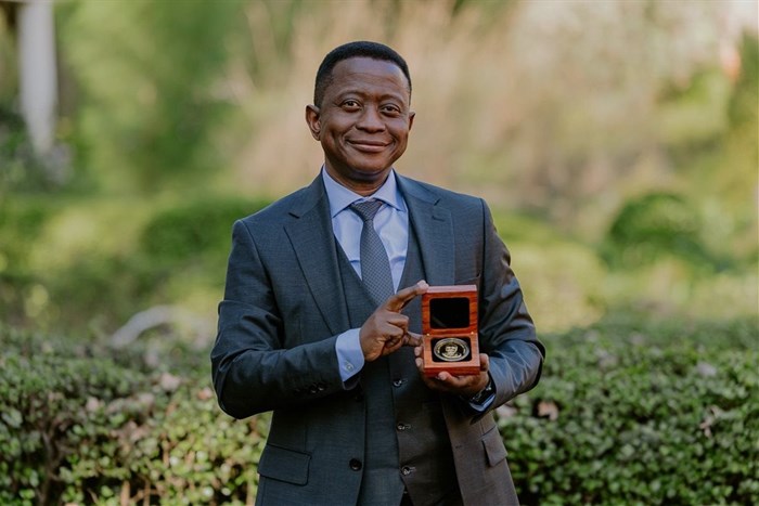 Professor Mike Sathekge – head of the Department of Nuclear Medicine at UP and Steve Biko Academic Hospital, and president and CEO of NuMeRI – with his Harry Oppenheimer Fellowship Award at the announcement ceremony at the Brenthurst Library. Image supplied.