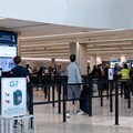 Travellers walk at the Charlotte Douglas International Airport in Charlotte, North Carolina, US. Image credit: Reuters/Kaylee Greenlee/File Photo
