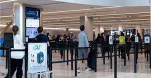Travellers walk at the Charlotte Douglas International Airport in Charlotte, North Carolina, US. Image credit: Reuters/Kaylee Greenlee/File Photo
