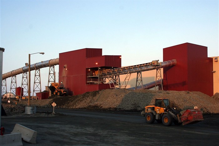 Two loaders work outside the ore processing and recovery plant at De Beers' Snap Lake Diamond Mine, Northwest Territories, Canada. Image credit: , , via Wikimedia Commons