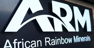 A logo of the African Rainbow Minerals (ARM) is seen at the company's offices in Sandton. Image credit: Reuters/Siphiwe Sibeko
