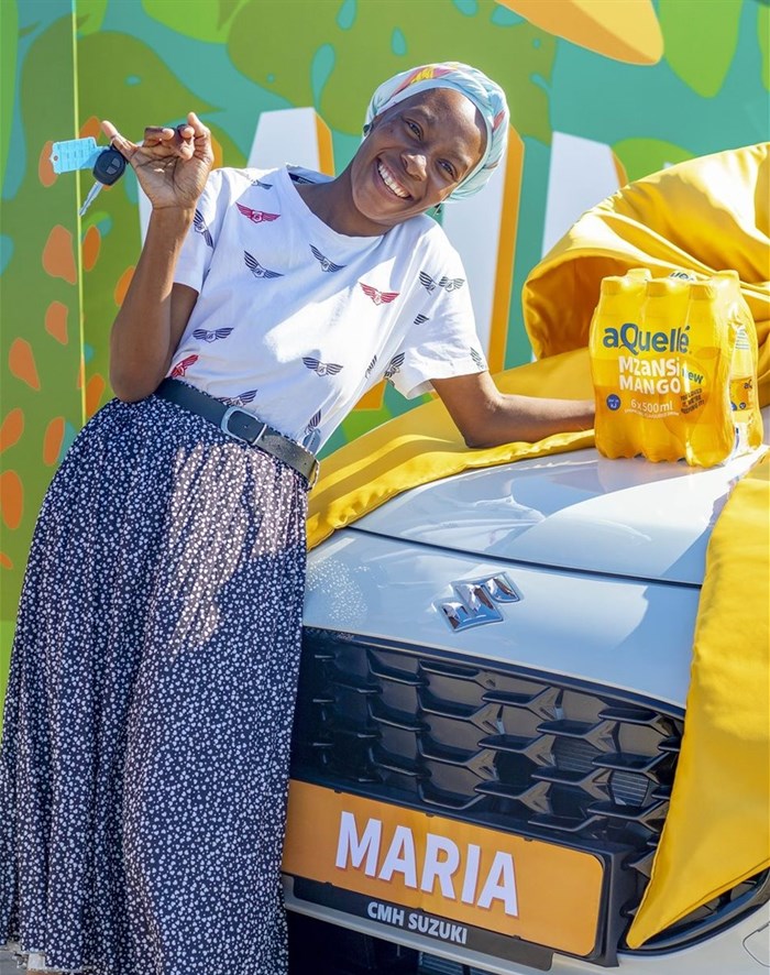 Happy winner of a brand new car_aQuellé Mzansi Mango Competition.