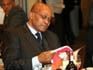 Jacob Zuma peruses a copy of 50 years of journalism in South Africa. Picture courtesy of Zoopy.com team.