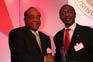 Mo Ibrahim receiving the lifetime achievement award from Godwin Emefiele Deputy Managing Director of Zenith Bank