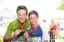 Michael Mol with his son Joshua at the OUTsurance 94.5Kfm Gun Run, after completing the 10km race