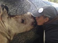 South African golfer and LET rookie Nicole Garcia gives kisses to rhino at SA Women's Open