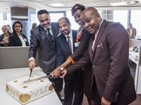 Etihad Airways’ Pam Van Pletsen looks on while Maurice Phohleli, Ambassador Haman Hareb Alhasi and crew members Rofiloe Motloung and Donray Gaveni cut the cake