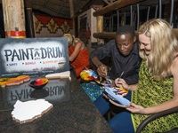 Image 3 - A guest enjoys the new drum painting activity at The Boma - Dinner & Drum Show